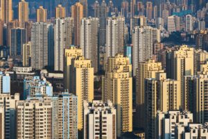 Aerial view of densely packed high-rise buildings in a vibrant urban skyline. — chiński rynek nieruchomości