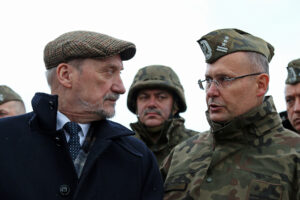 Antoni Macierewicz (left), Polish minister of defense speaks with Col. Andrzej Dabrowski (right)