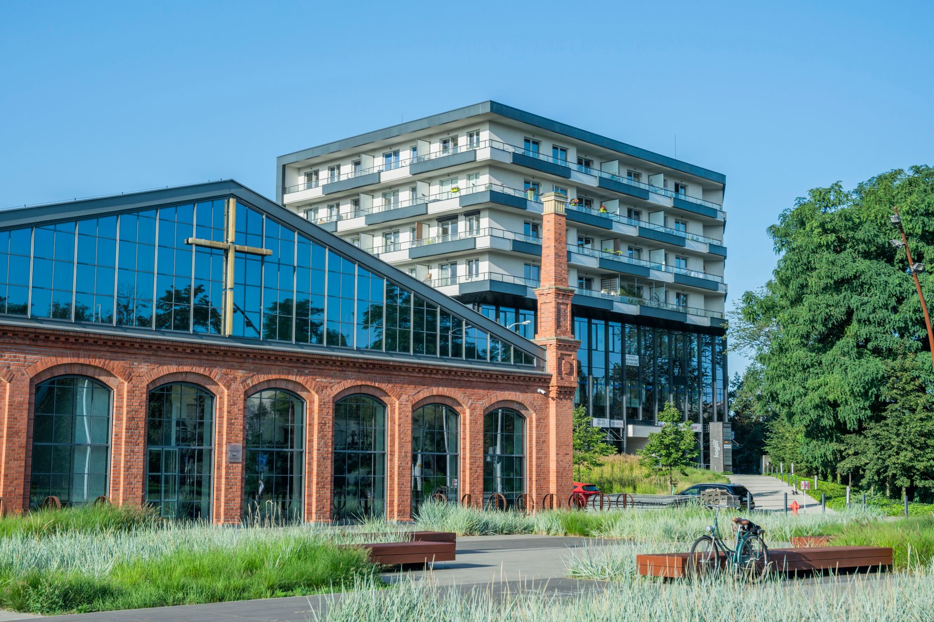 Modern buildings in Wrocław showcasing architectural diversity on a sunny day. — Polski Komitet Olimpijski