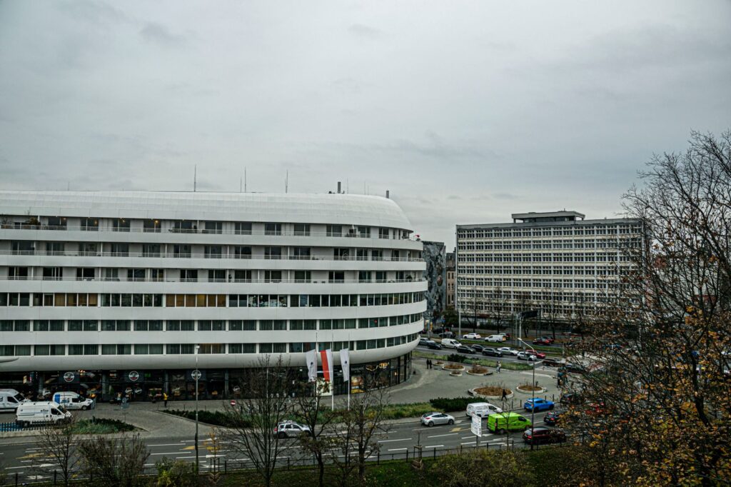 Street view of modern buildings in Wrocław, Polska, capturing urban architecture. — Polski Komitet Olimpijski w Warszawie