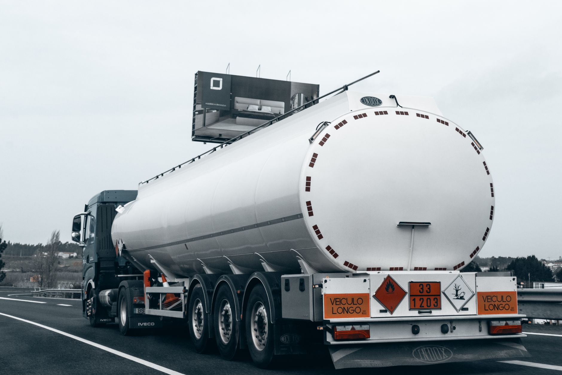 Rear view of a large tanker truck transporting fuel on a highway, emphasizing logistics and — import rosyjskiego oleju napędowego