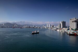A vivid aerial shot capturing the vibrant port and skyline of Sokcho, South Korea. — Korea Południowa i sankcje